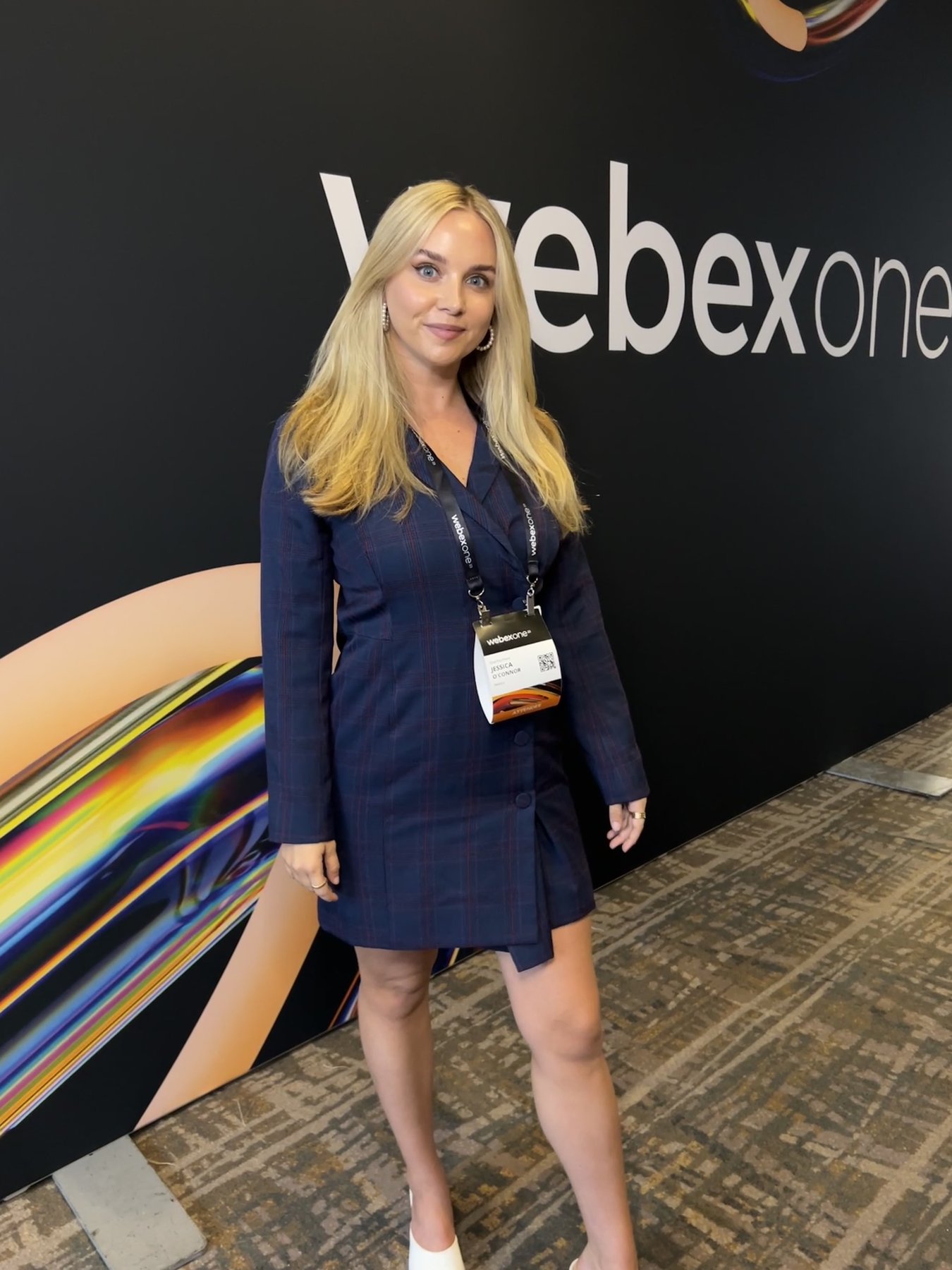 Jessica O'Connor at WebexOne 2023 in a navy plaid blazer dress
