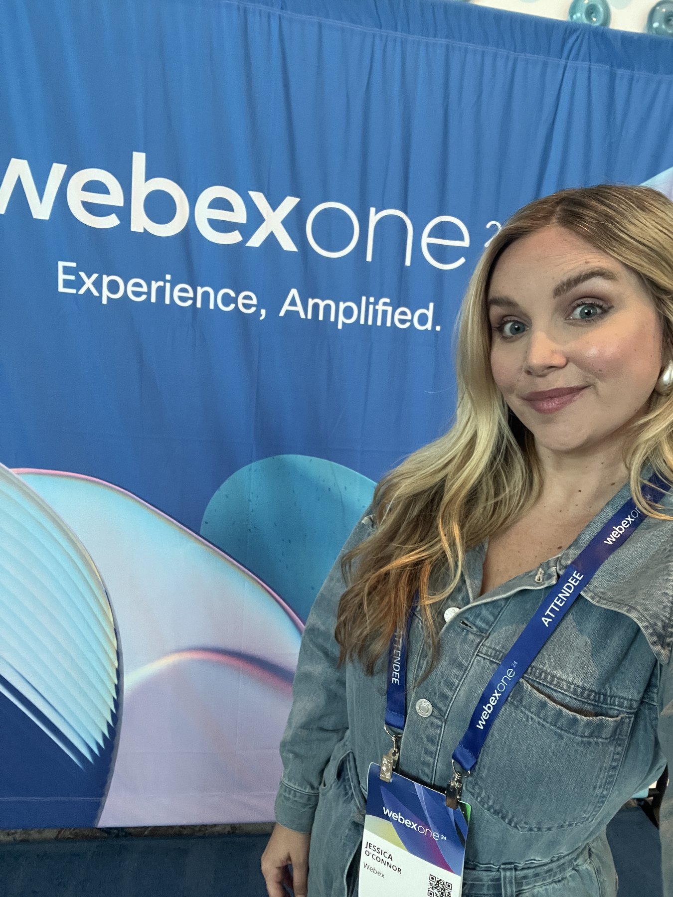 Jessica O'Connor at WebexOne 2024 in front of the "Experience, Amplified" backdrop